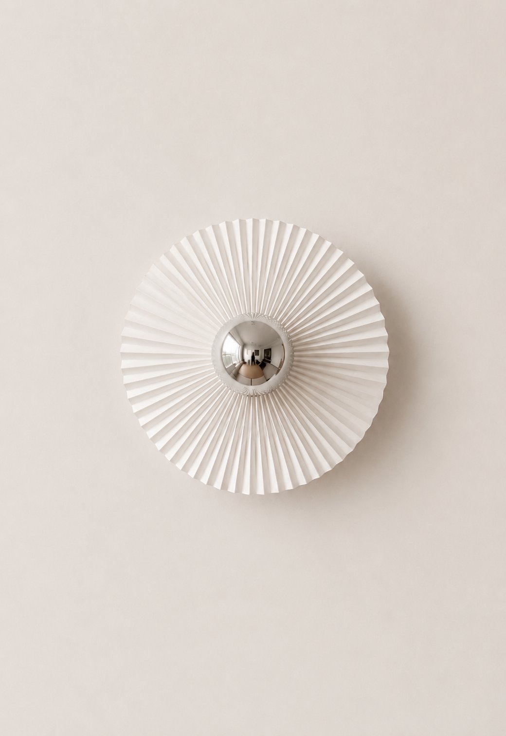 Flat pleated sunburst wall sconce with a convex mirror centre